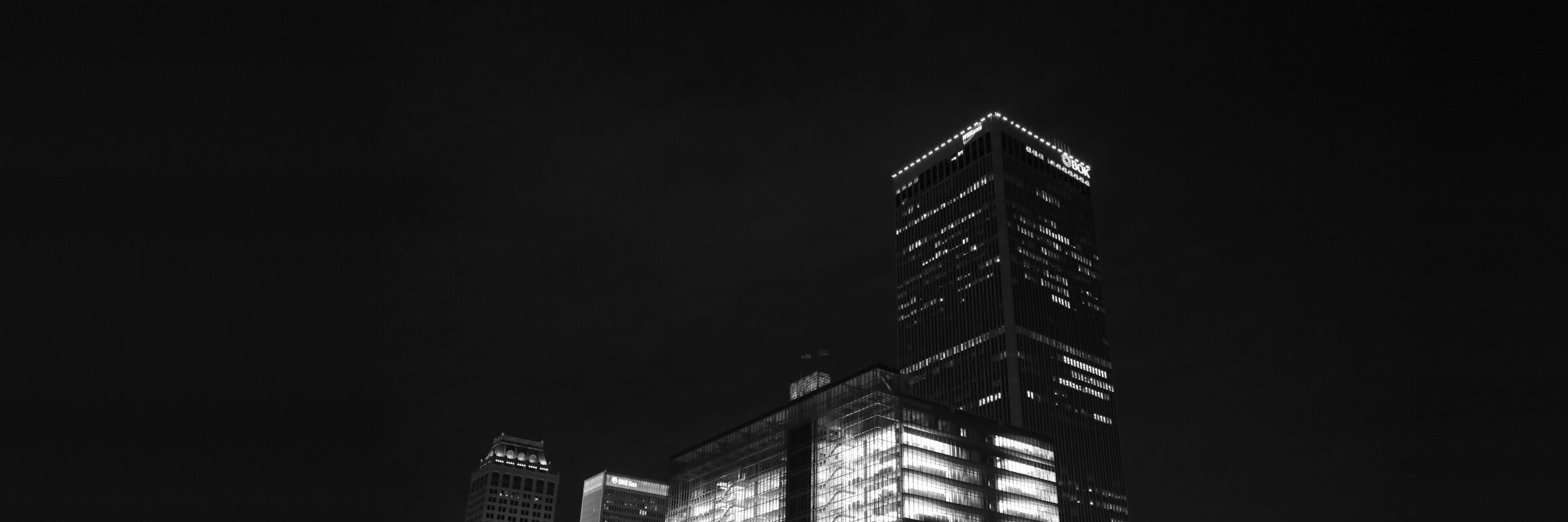 Black-and-white night photo of BOK Tower in downtown Tulsa, Oklahoma